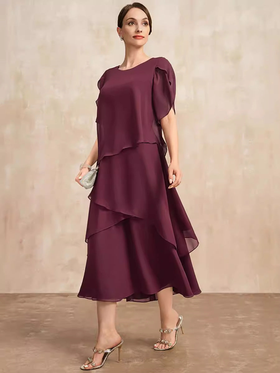 Layered chiffon midi dress styled as a fall wedding guest outfit