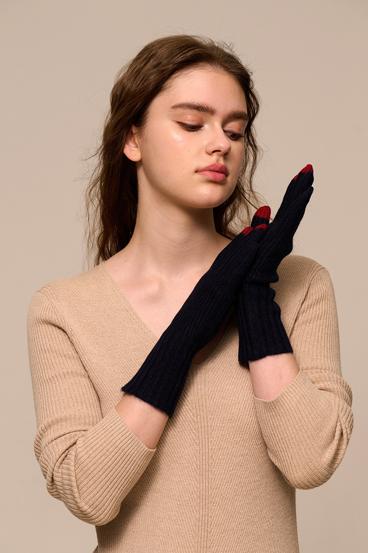 Margo & Main - navy cashmere gloves worn with the long ribbed cuff over the wrist, one size