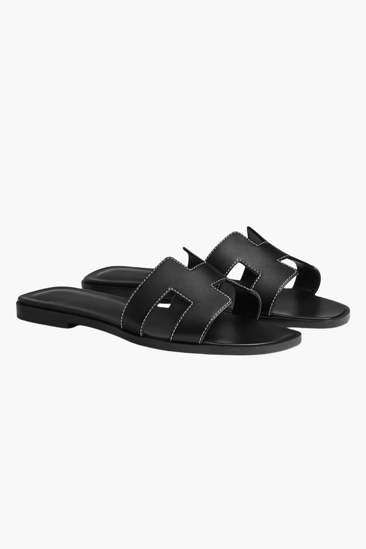 Margo & Main – flat cutout leather slide sandals, angled view, US women's sizes