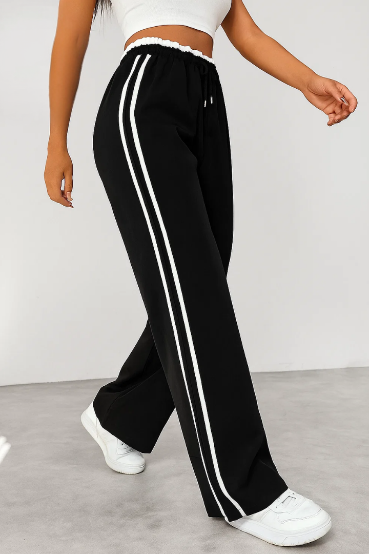 Margo & Main – Black side-stripe pull-on trousers, walking side view, US women's sizes