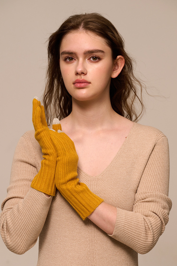 Margo & Main - mustard yellow cashmere gloves worn crossed to show the ribbed knit, one size