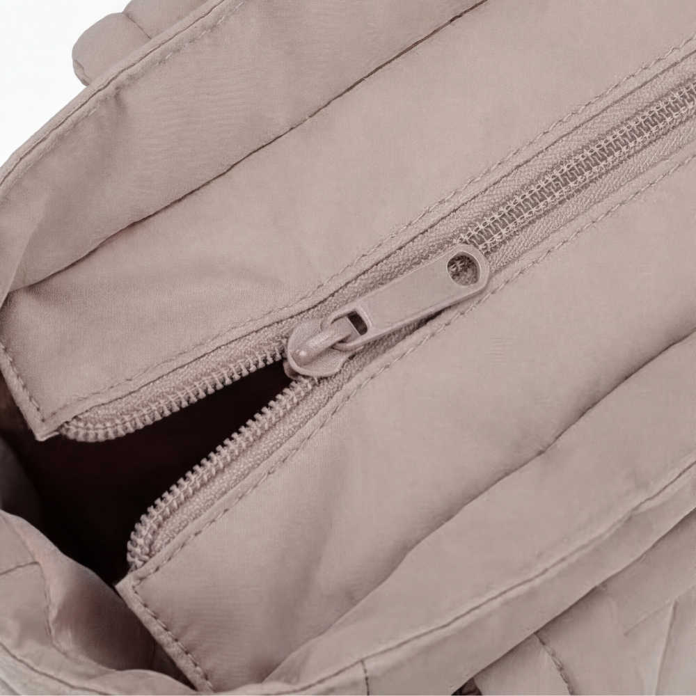 Margo & Main – Tova tan quilted tote, close-up of the top zip pocket and quilted stitching