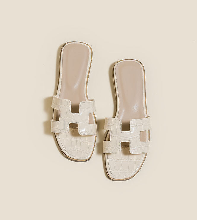 A pair of beige slide sandals with a chunky woven strap detail, shown from multiple angles on a light beige background with text overlays from 'LDDS SHOP'.