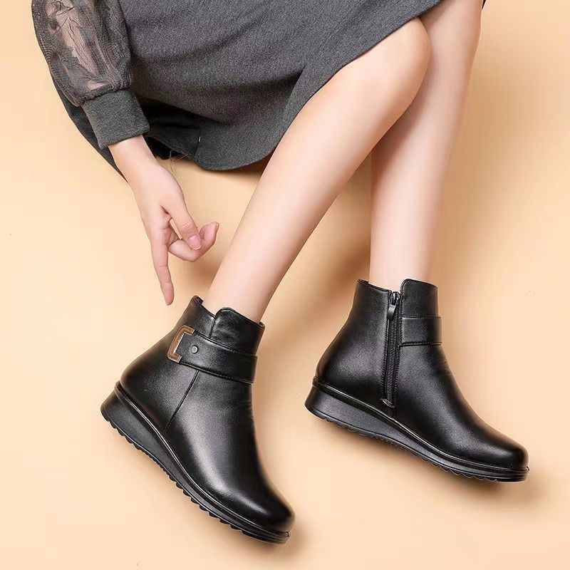 Margo & Main – Tilda black fleece-lined leather ankle boots, seated model view with a grey dress, US women's sizes