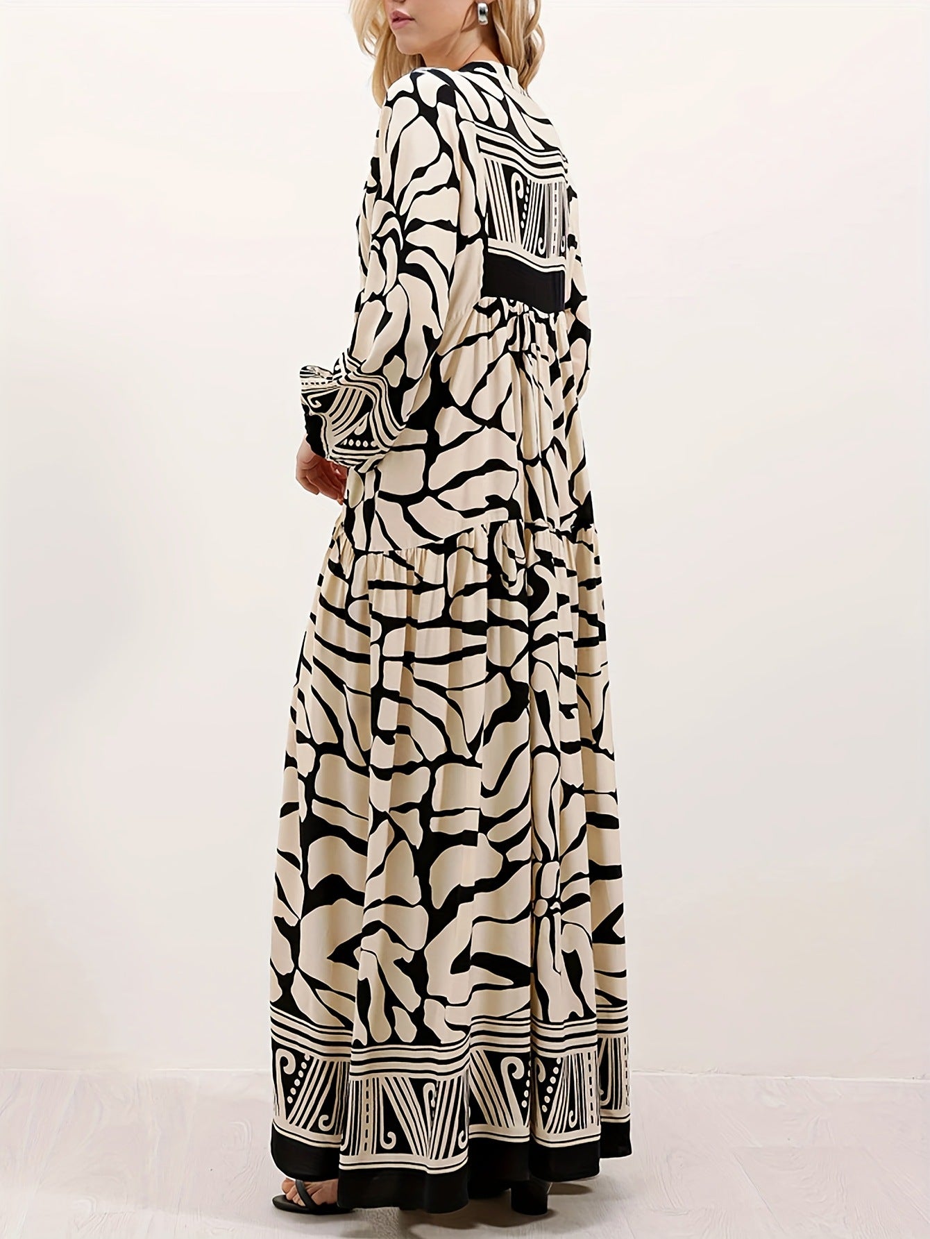 Margo & Main – cream and black print maxi dress worn with a clutch bag, US women's sizes