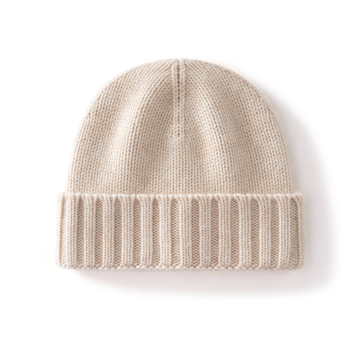 Margo & Main ivory ribbed cashmere fisherman beanie — angled view of the folded ribbed cuff and crown
