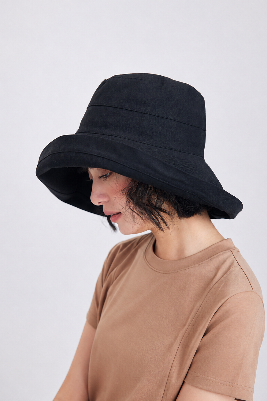 Margo & Main – Elke black wide-brim foldable sun hat in side profile, showing the deep downward brim