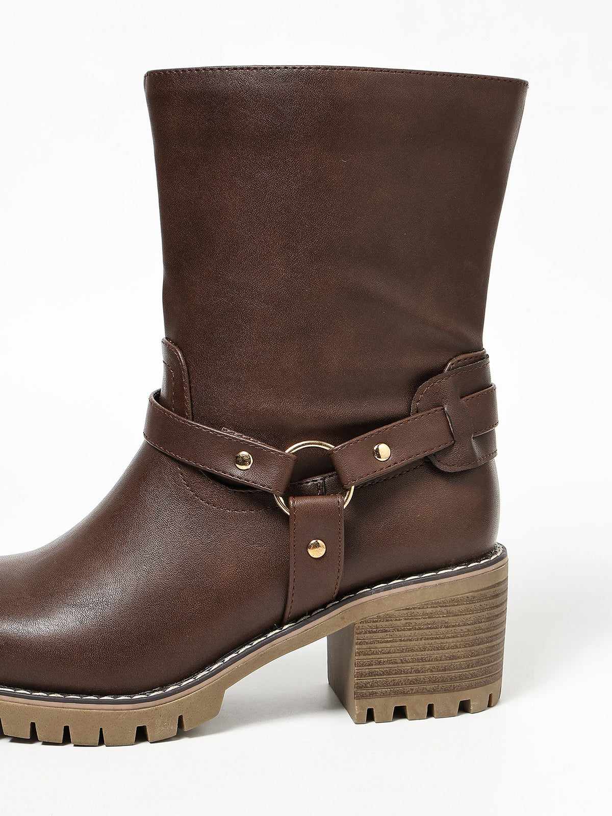 Margo & Main brown harness strap mid-calf riding boots — side view of the ring buckle strap and lug sole