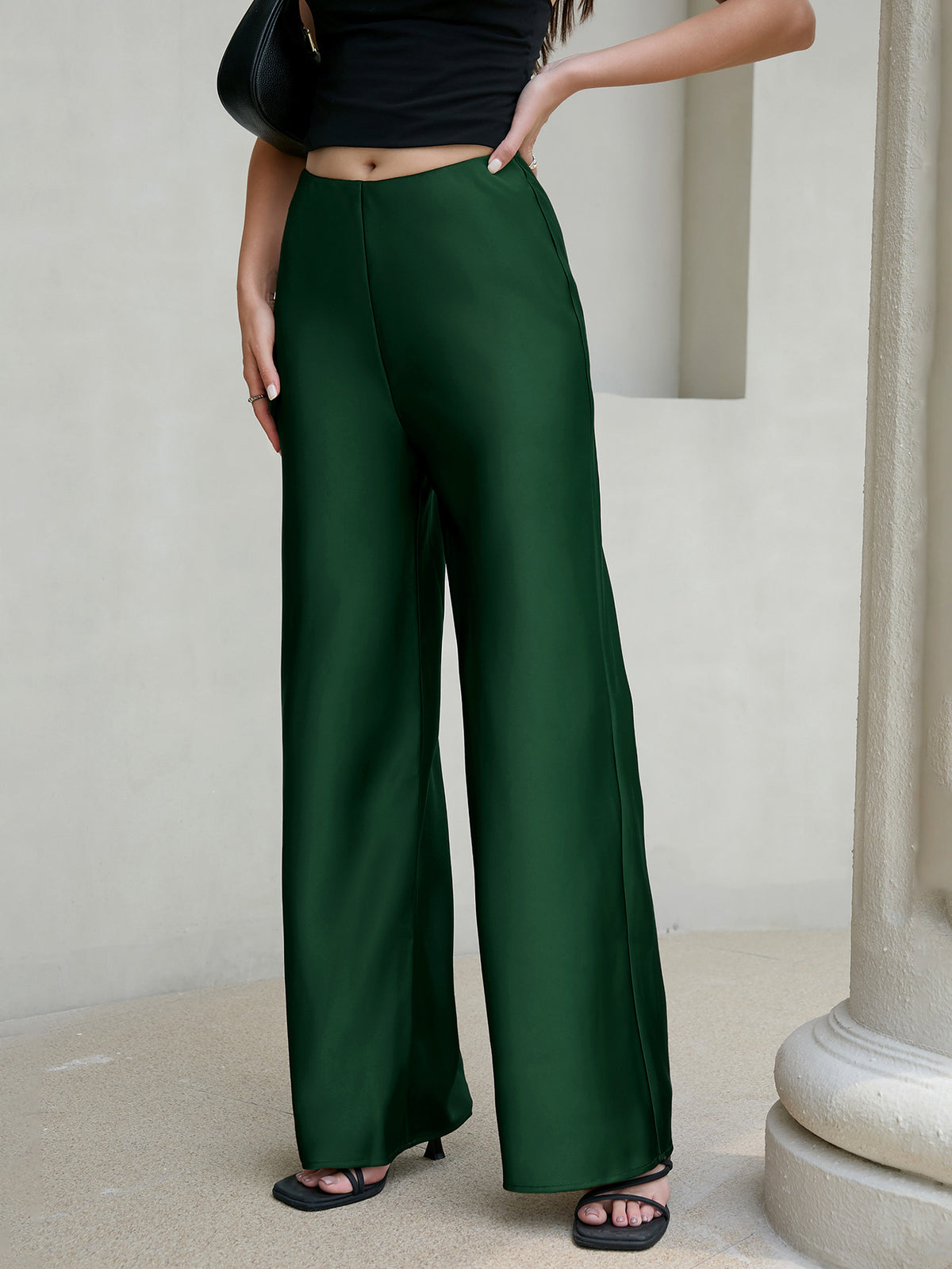 Margo & Main green satin wide-leg pants — angled view of the drape from hip to hem, US women's sizes