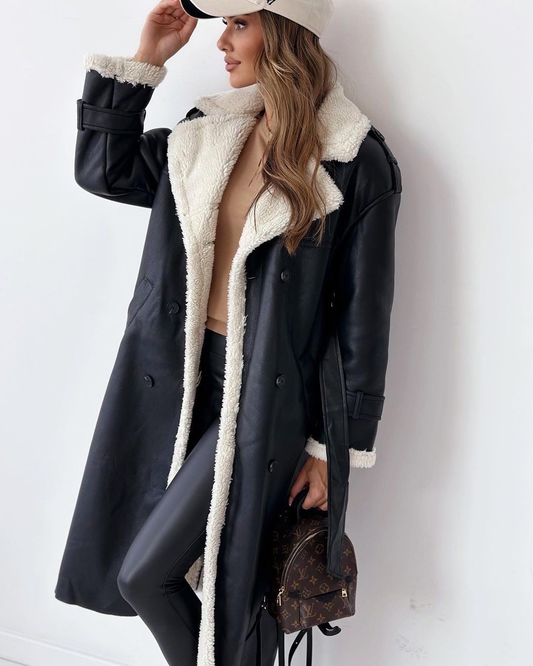 Margo & Main black faux shearling coat — side view of the shearling lined edge, US women's sizes