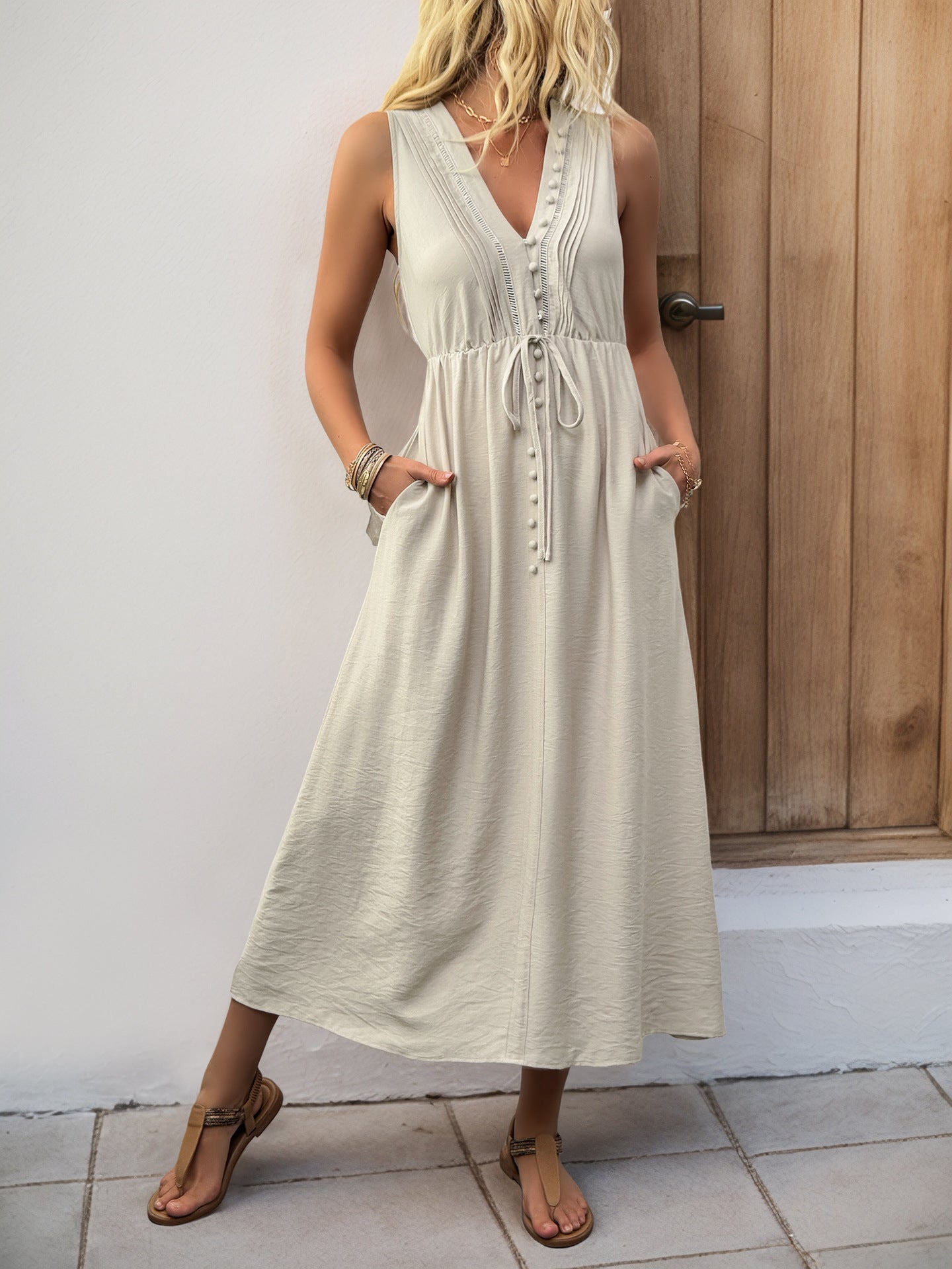 Flattering sleeveless midi dress for women over 40, shown with a defined waistline