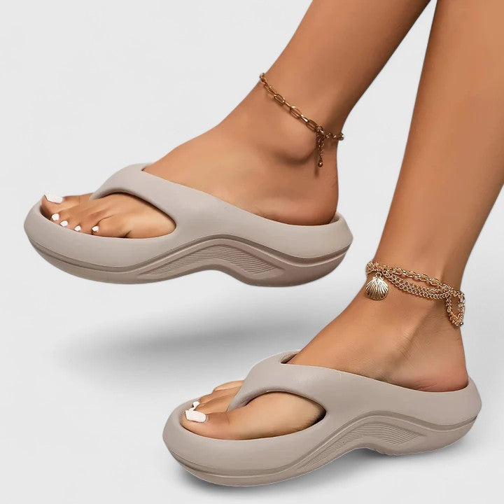 Margo & Main - taupe grey cushioned thong sandals worn stepping forward, US women's sizes