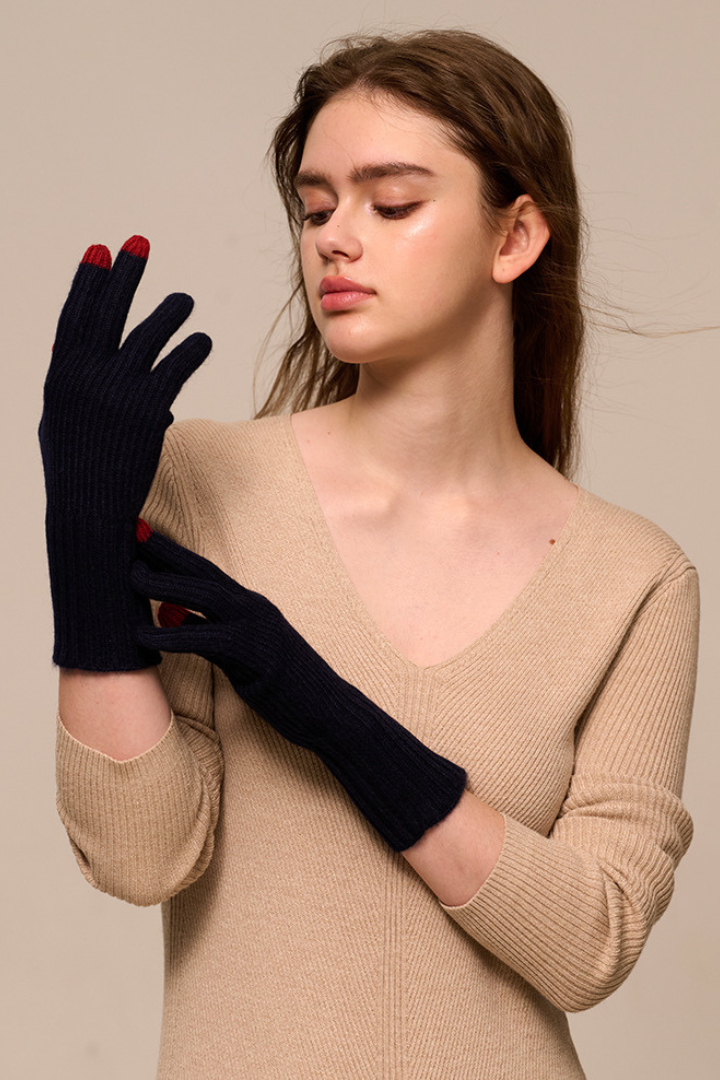 Margo & Main - navy cashmere gloves for women worn with red contrast fingertips, one size