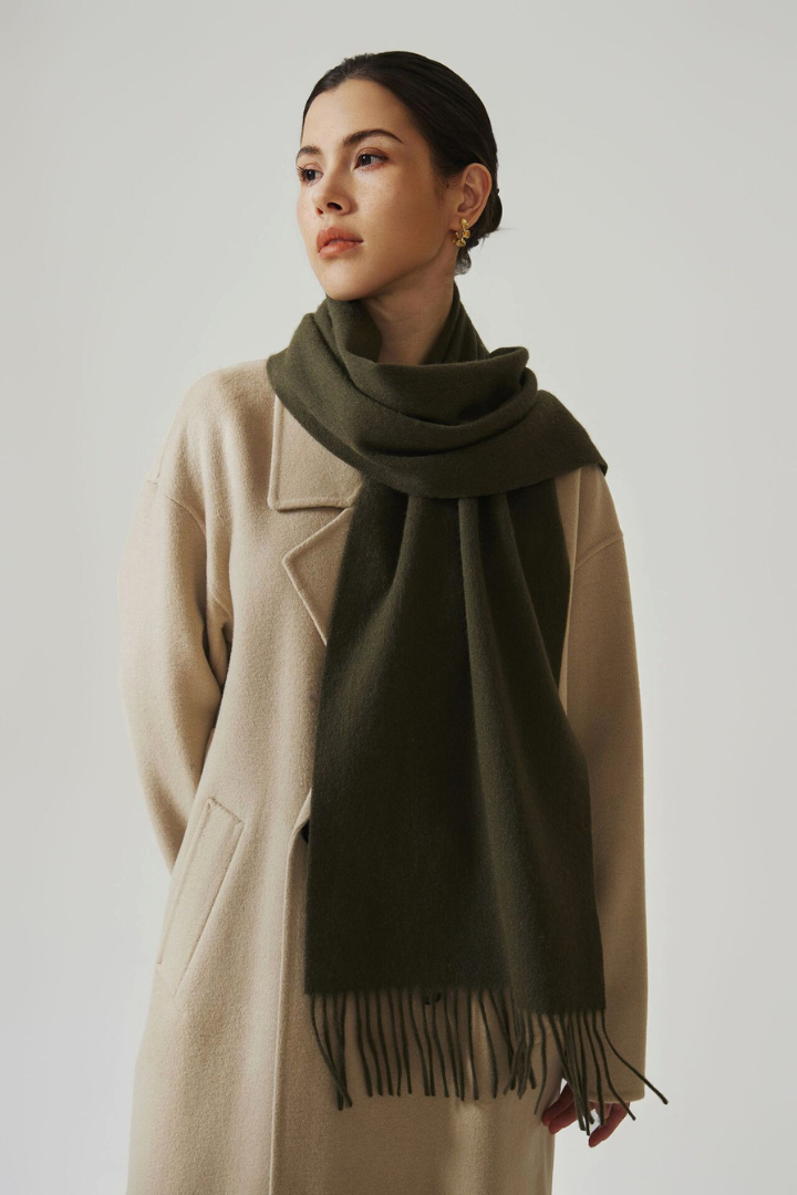 Margo & Main - olive green lamb wool scarf for women worn over a tan wool coat, one size