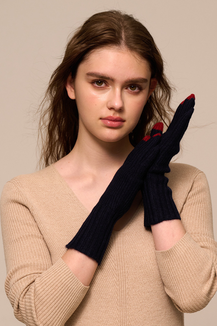 Margo & Main - navy cashmere gloves, hand raised to show the slim flexible knit fit, one size