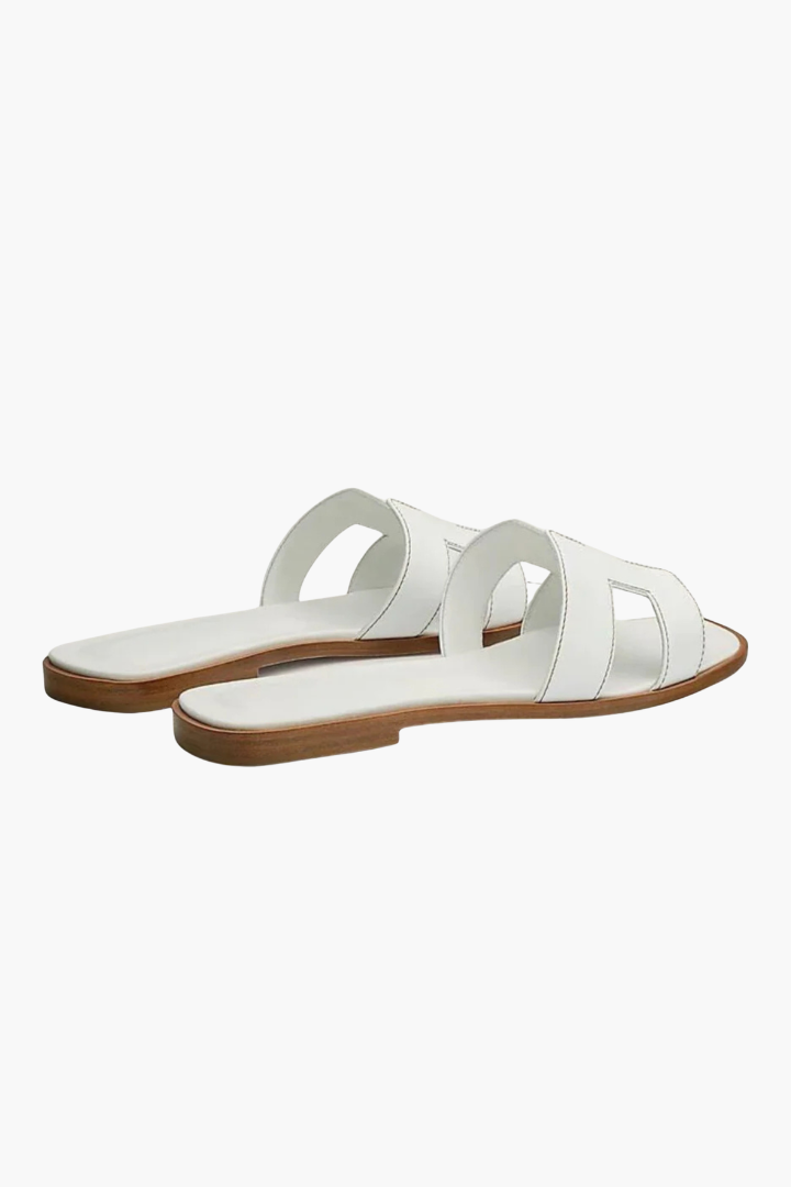 Margo & Main – white flat cutout leather slide sandals angled pair view, US women's sizes