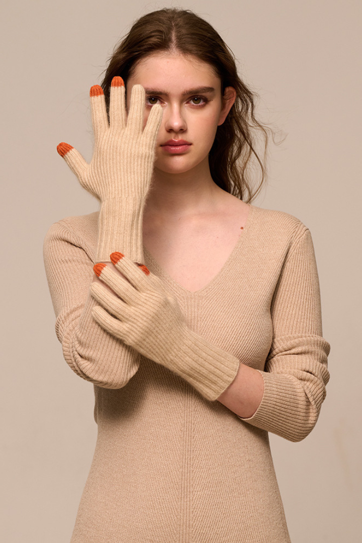 Margo & Main - beige cashmere gloves for women worn with orange contrast tips, one size