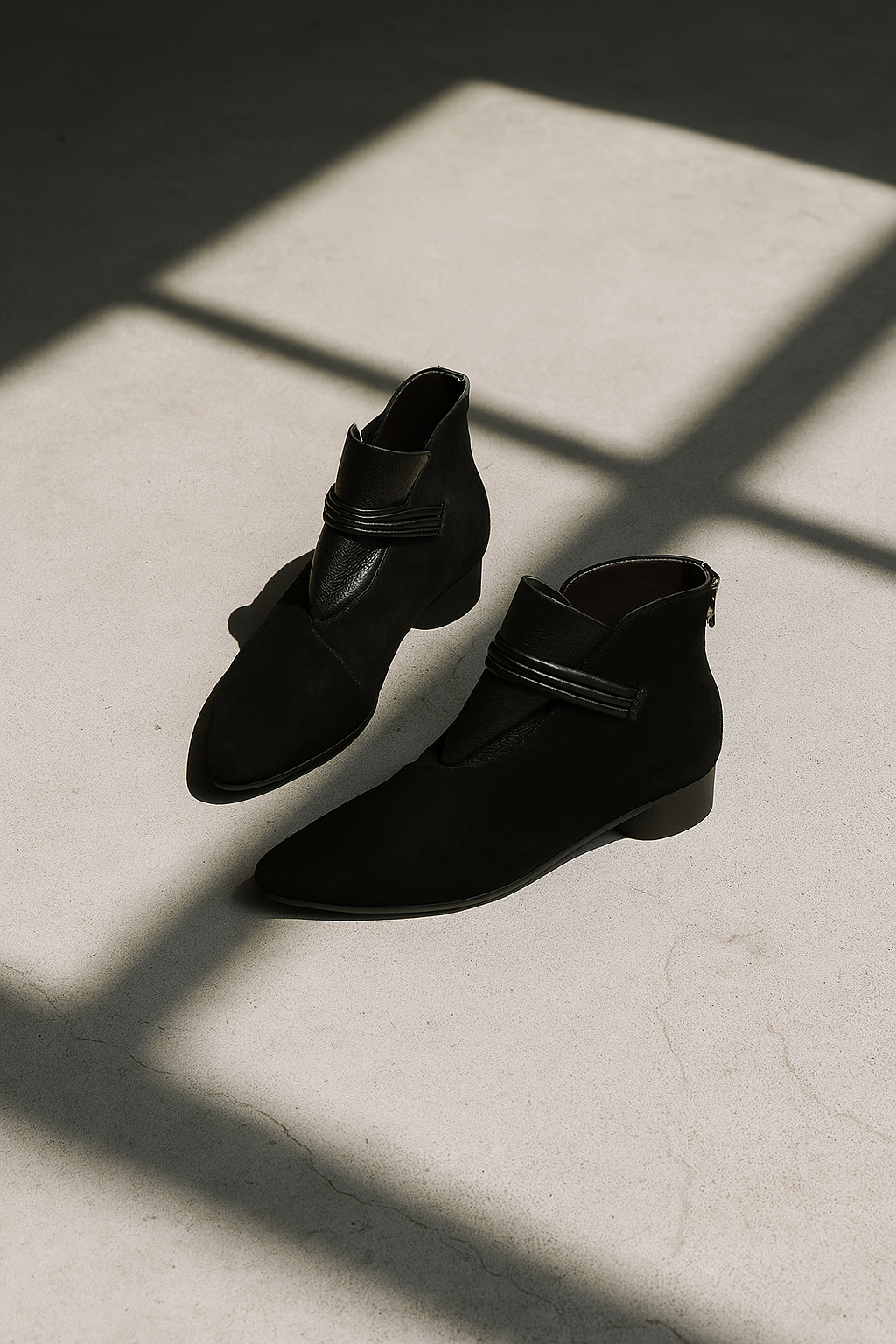 Margo & Main – black suede ankle boots pair shown in soft natural daylight, US women's sizes