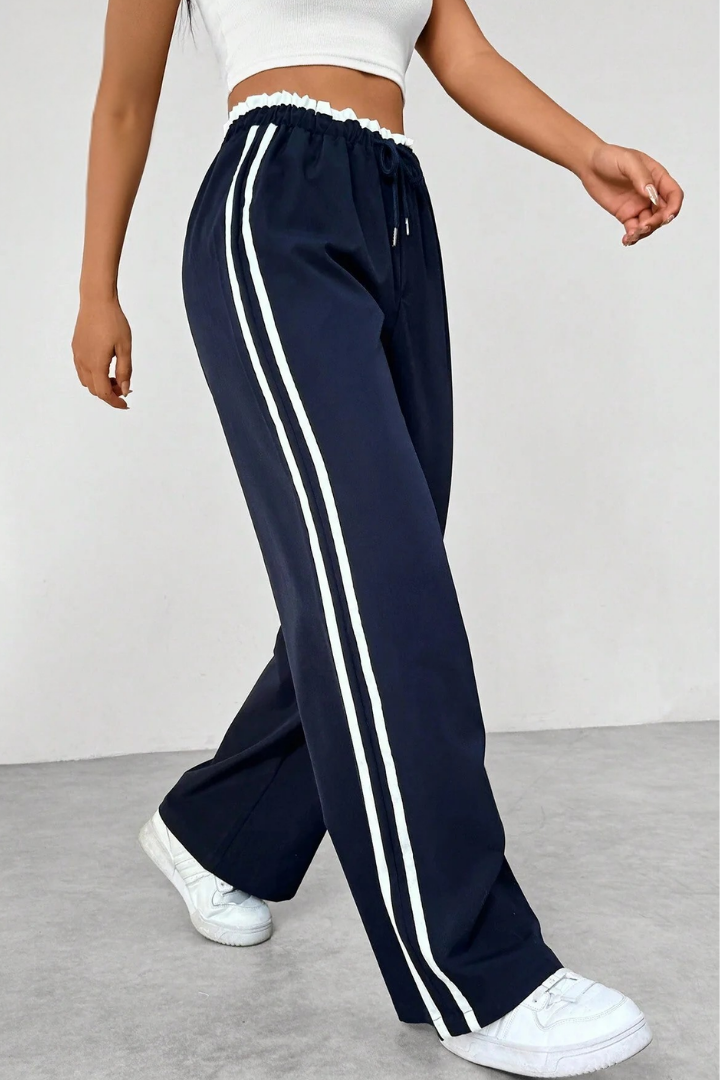 Margo & Main – Navy side-stripe pull-on trousers, walking side view, US women's sizes