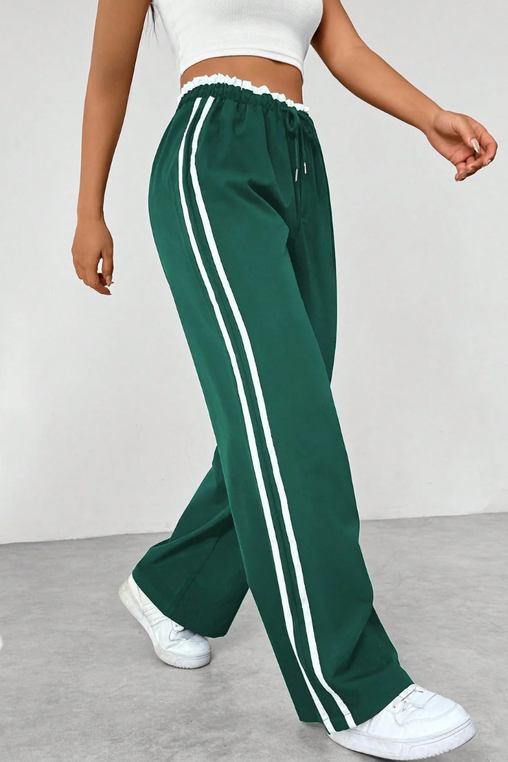 Margo & Main – Green side-stripe pull-on trousers, walking side view, US women's sizes
