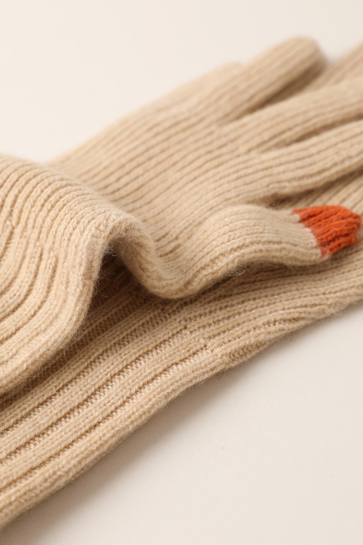 Margo & Main - beige cashmere gloves laid flat, detail of the ribbed cuff and thumb, one size