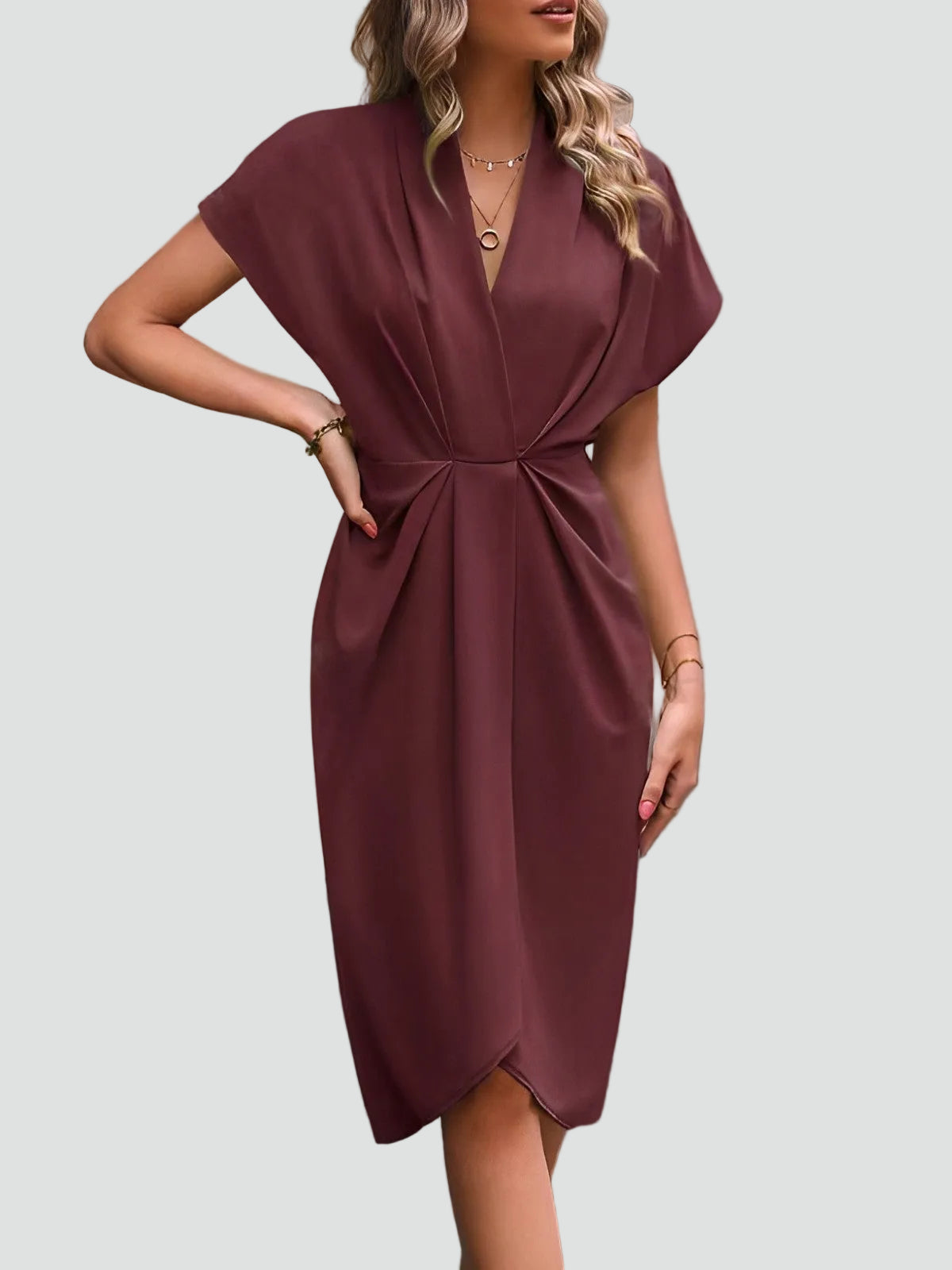 Margo & Main - rust wrap midi dress styled with a clutch bag, US women's sizes