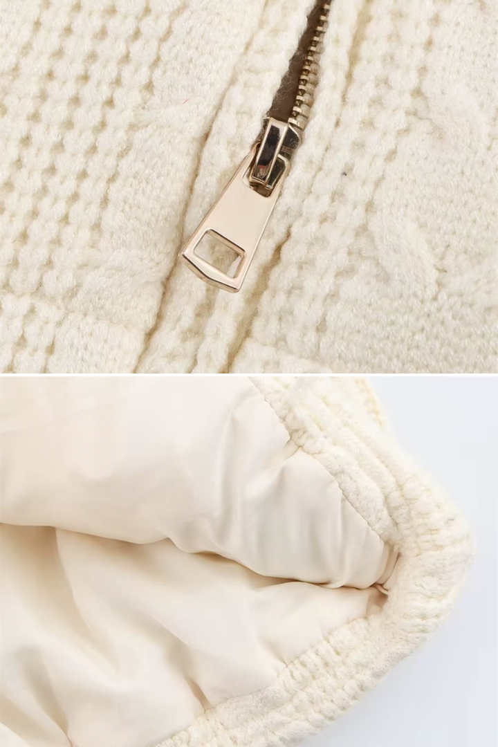 Margo & Main – Vigdis cream cable-knit quilted puffer vest, close-up of metal zip pull and lined ribbed hem, US women's sizes