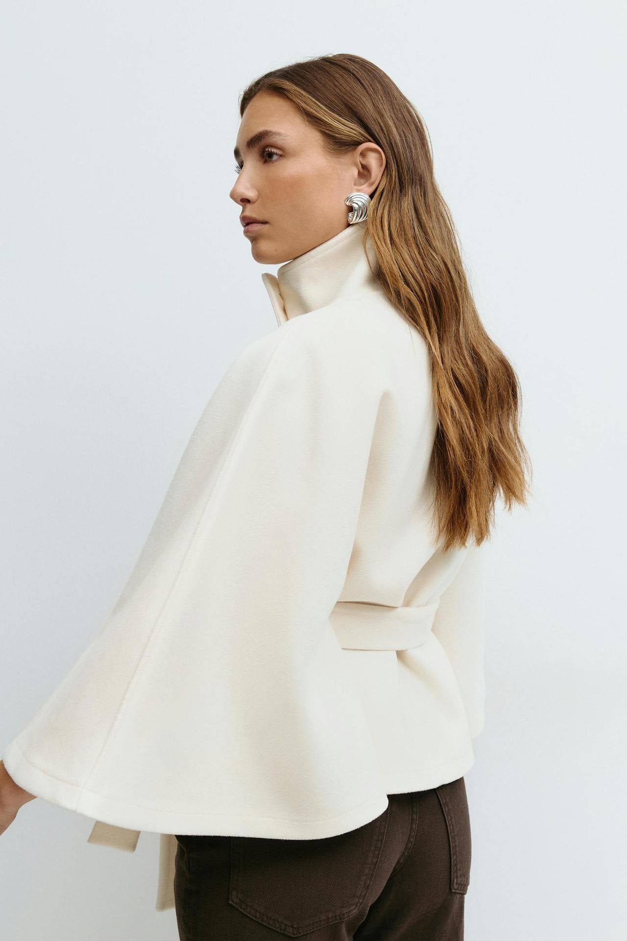 Margo & Main – Anneke ivory button-front belted cape coat, side and back view over brown trousers, US women's sizes