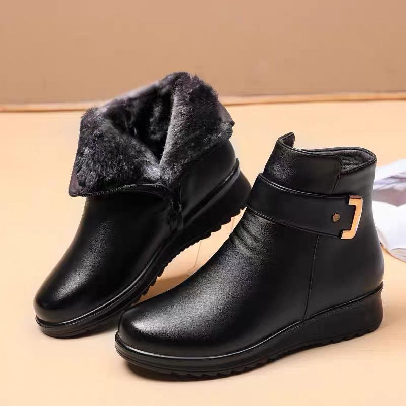 Margo & Main – Tilda black fleece-lined leather ankle boots with the grey fur collar folded down, pair on a tan backdrop, US women's sizes
