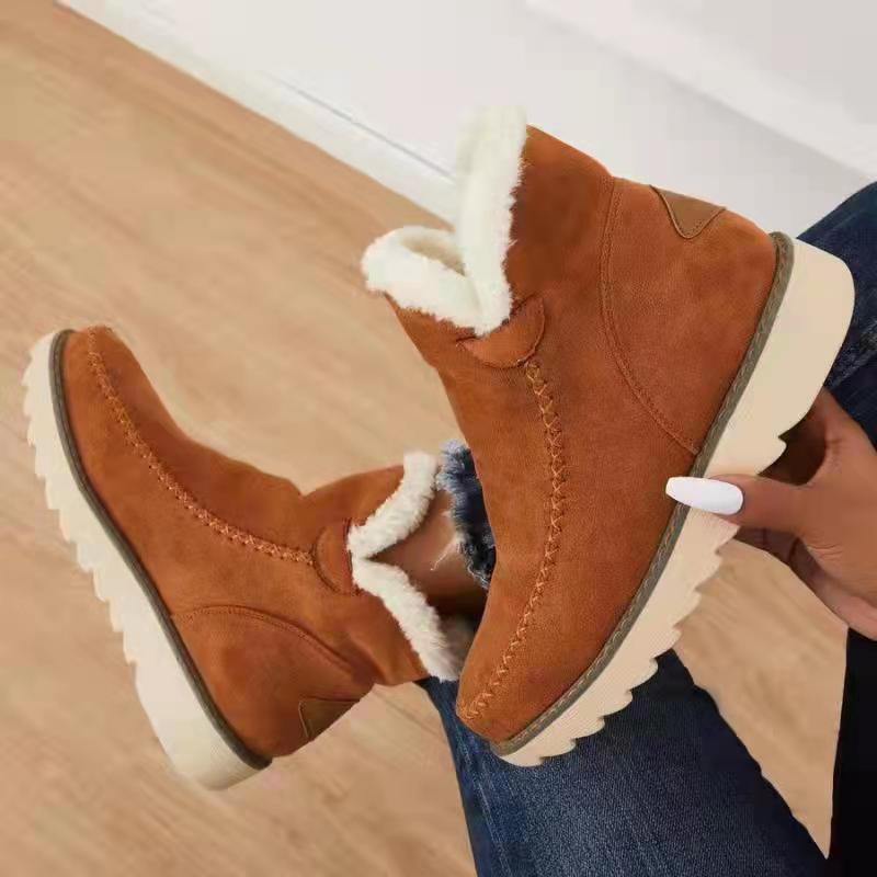 Margo & Main – Brown faux shearling booties held in hand, sole and collar, US women's sizes