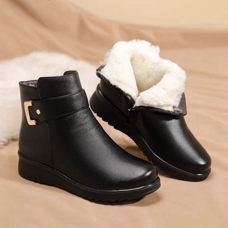 Margo & Main – Tilda black leather ankle boots with the cream fleece collar turned out, pair on a fur rug, US women's sizes