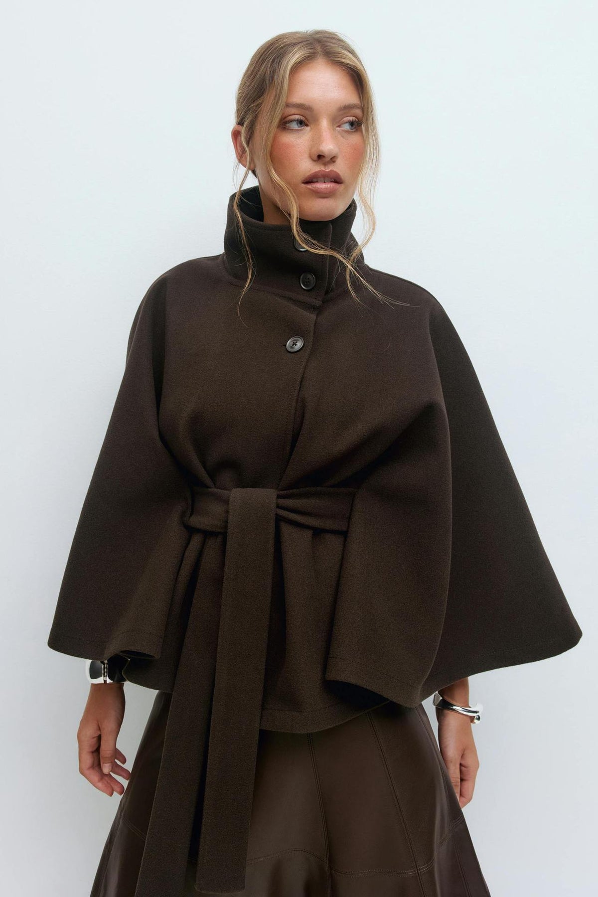 Margo & Main – Anneke chocolate brown button-front belted cape coat, waist-up front view with the belt tied, US women's sizes