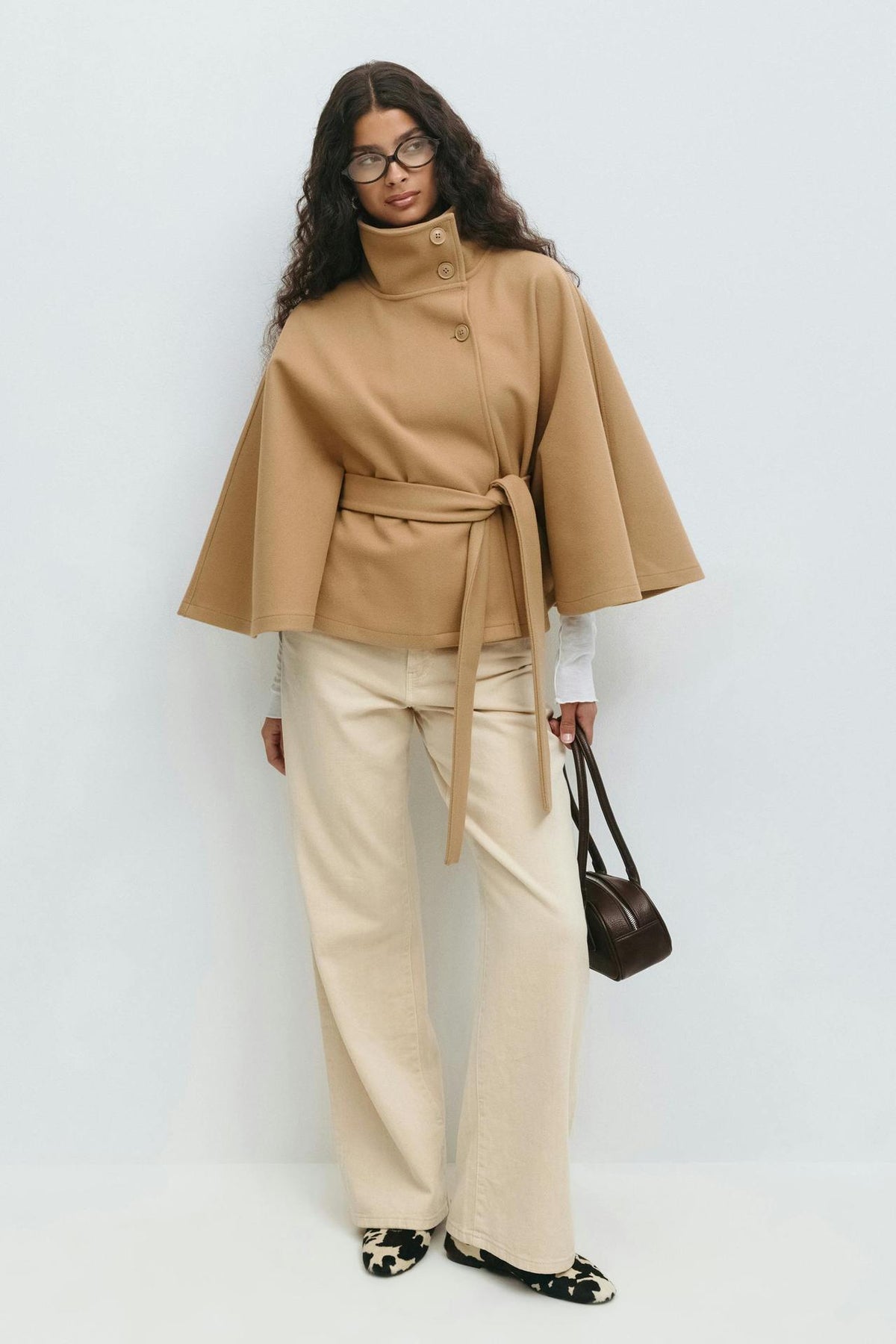 Margo & Main – Anneke camel button-front belted cape coat, full-length front view with cream trousers and a handbag, US women's sizes