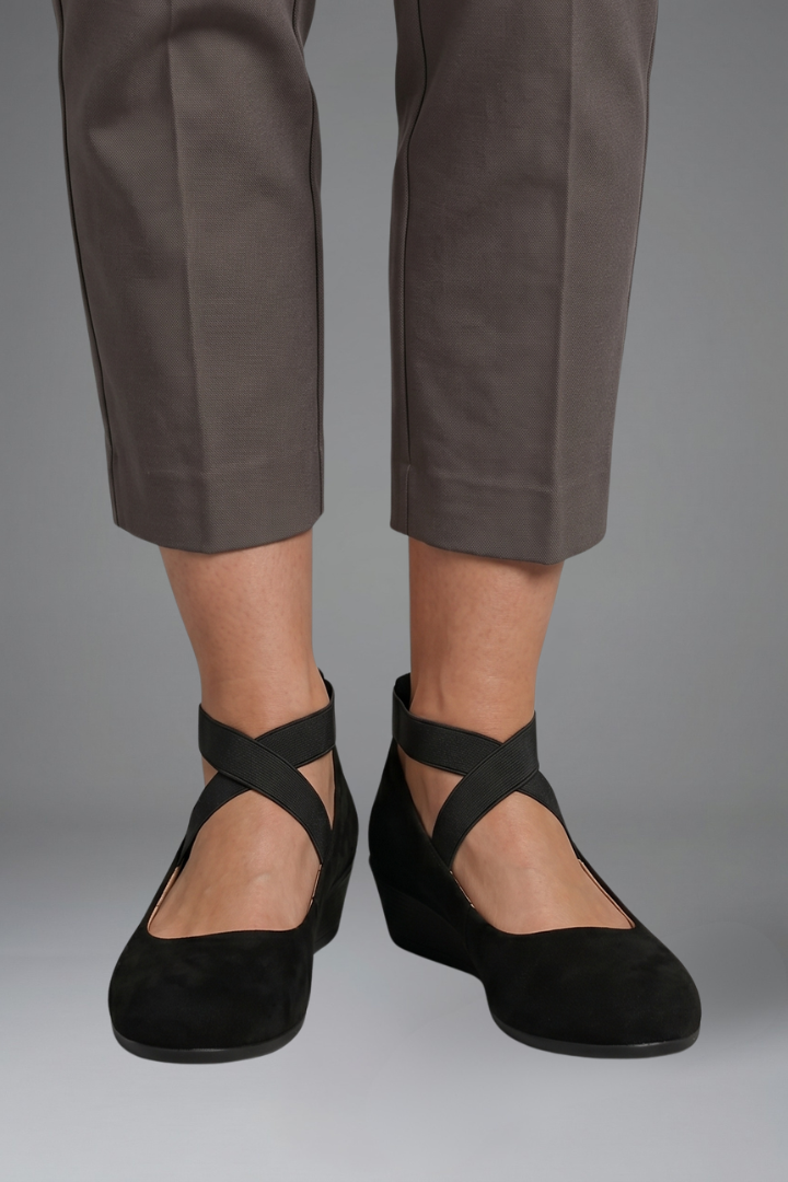 Margo & Main – Black suede cross-strap flats worn front view with trousers, US women's sizes