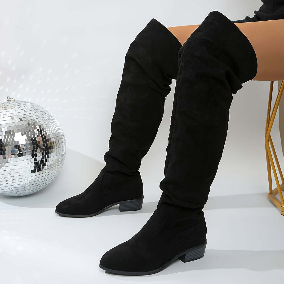 Margo & Main – black slouchy suede over-the-knee boots angled on a model, US women’s sizes