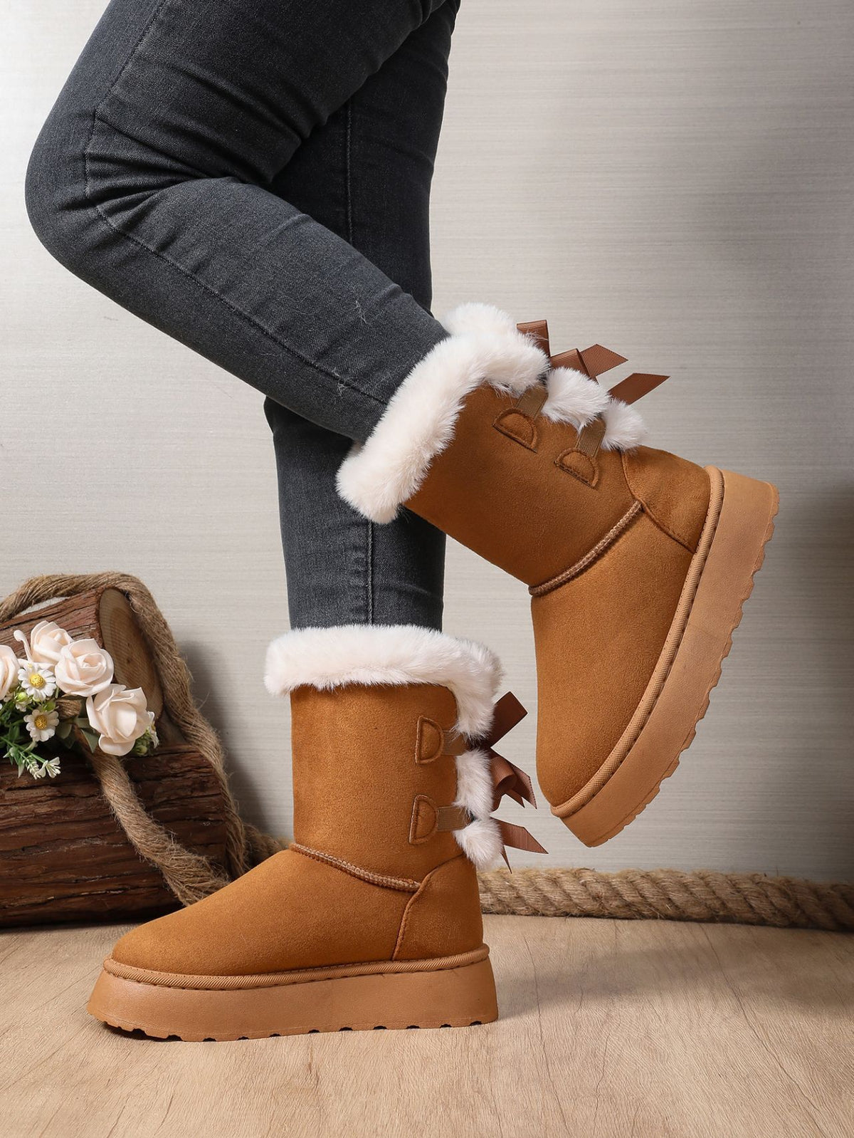 Margo & Main brown bow-back plush cuff platform snow boots — angled view of the platform sole
