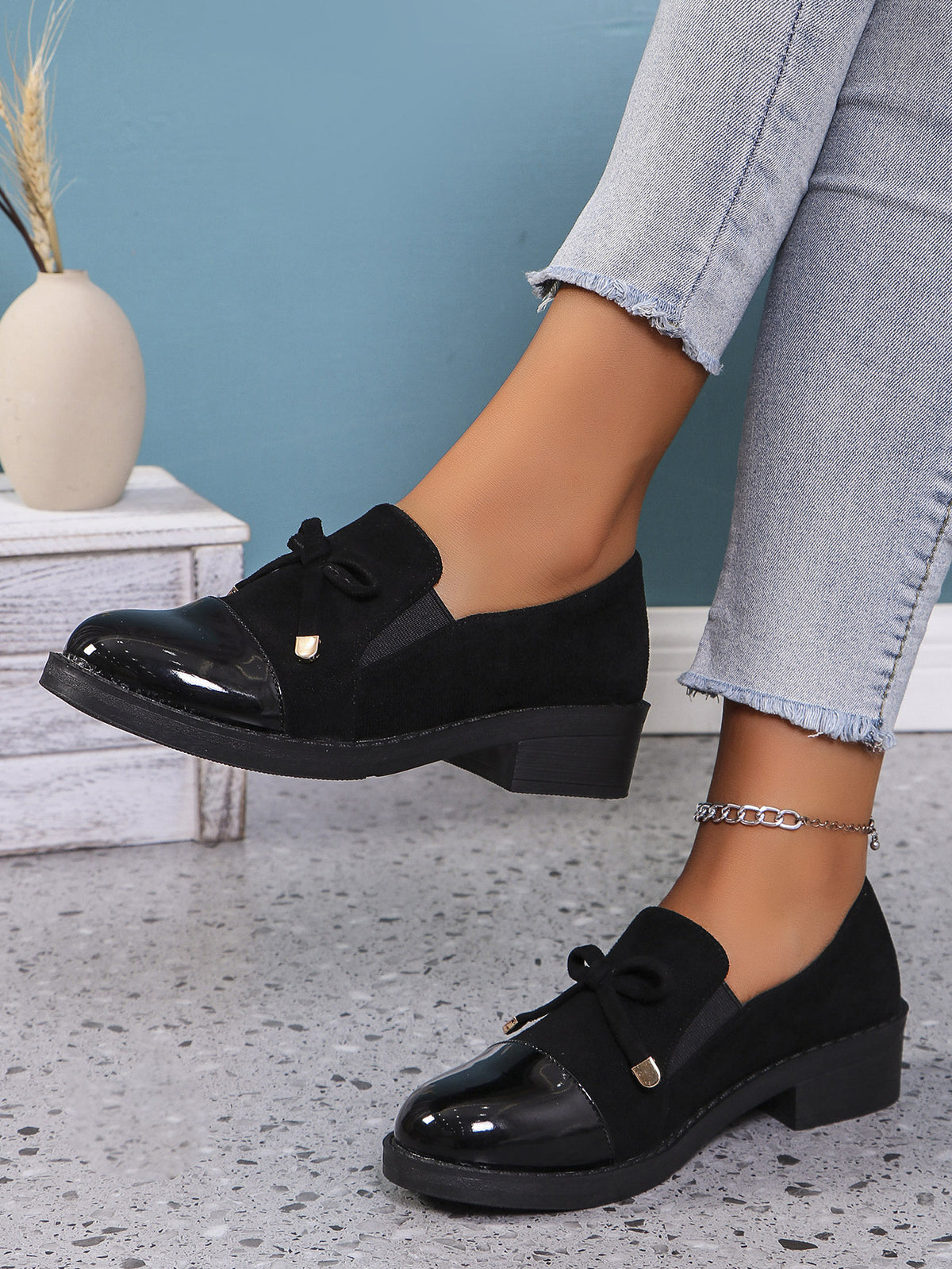 Margo & Main black bow patent cap-toe block heel loafers — side view of the low block heel, US women's sizes