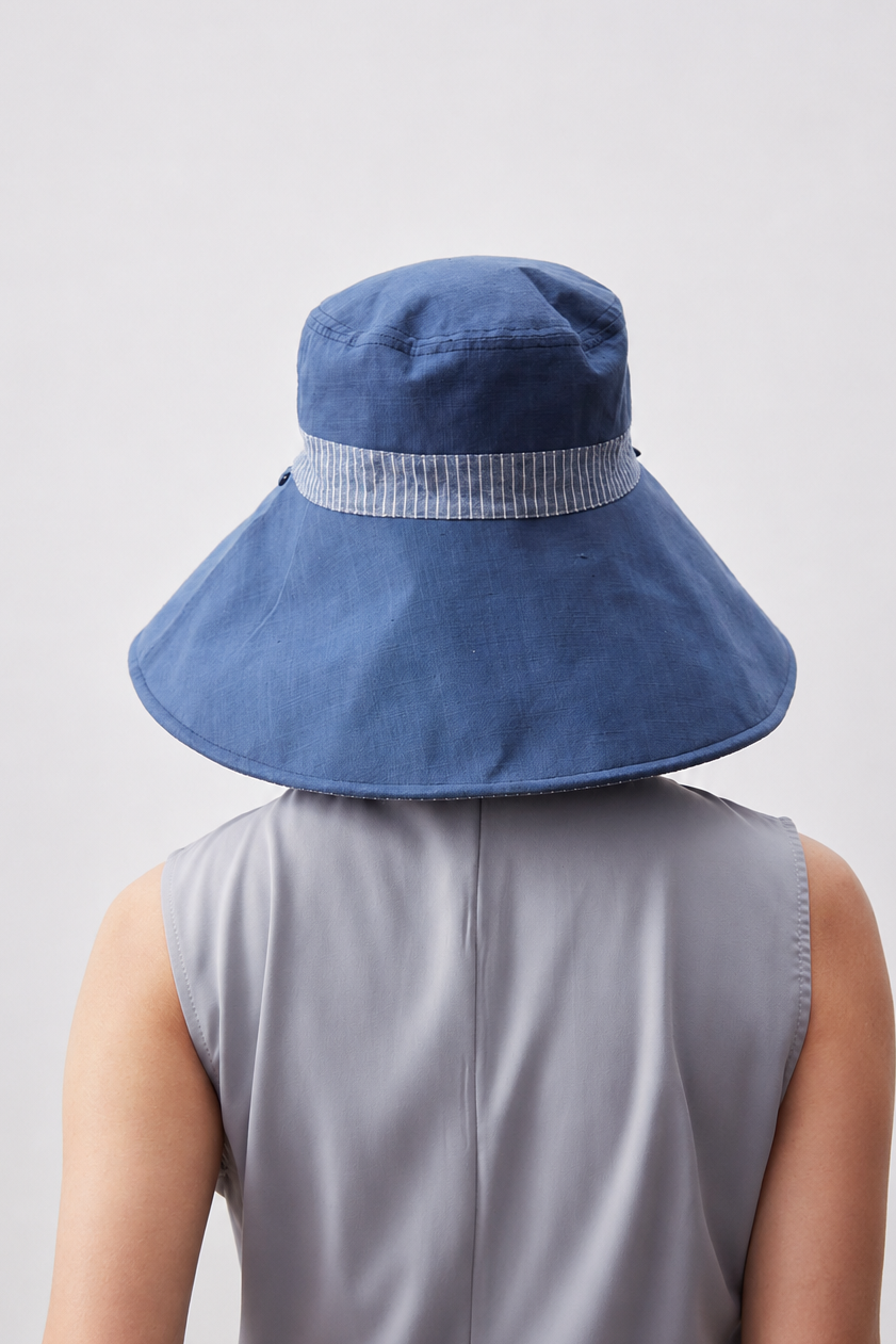 Margo & Main – Carmela blue reversible wide-brim bucket sun hat from the back, striped band wrapping the crown