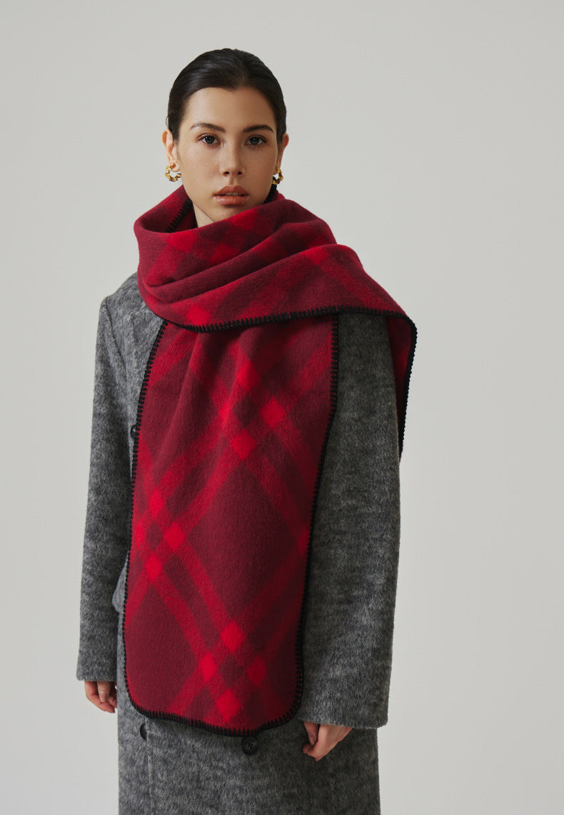 Margo & Main red check scarf — front view wrapped over a gray coat, blanket stitch edge