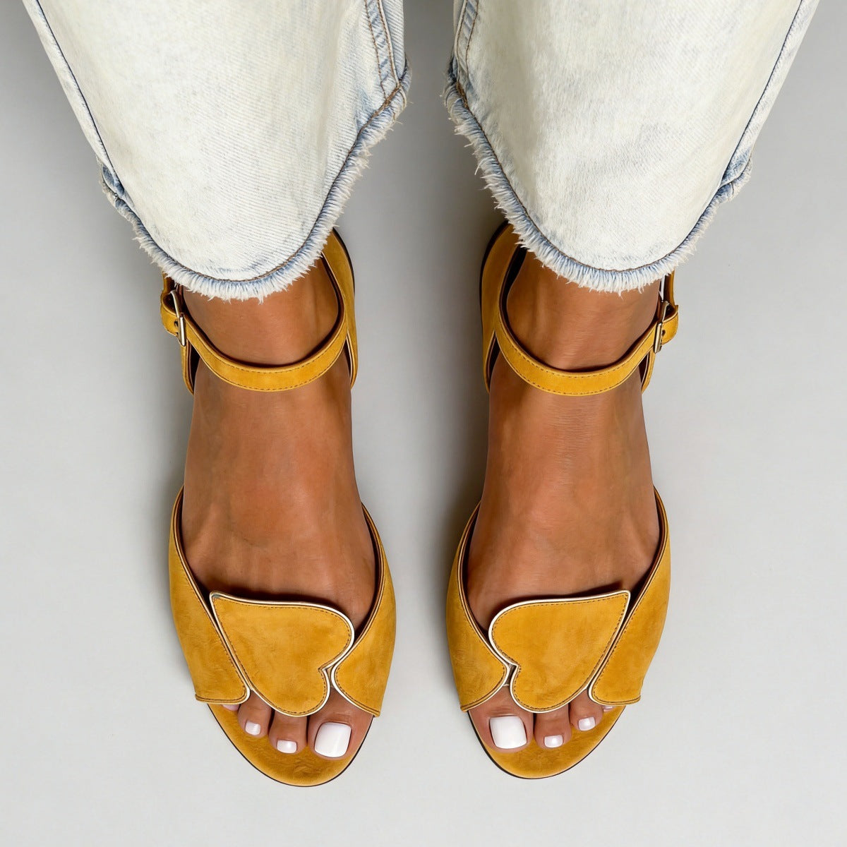 Margo & Main yellow heart cutout sandals — overhead view of the toe strap and sole, US women's sizes