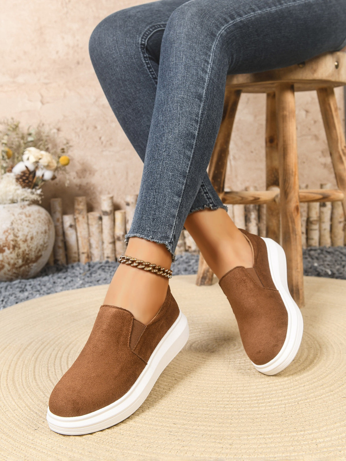 Margo & Main brown suede-look platform slip-on sneakers — worn seated view of the white platform sole