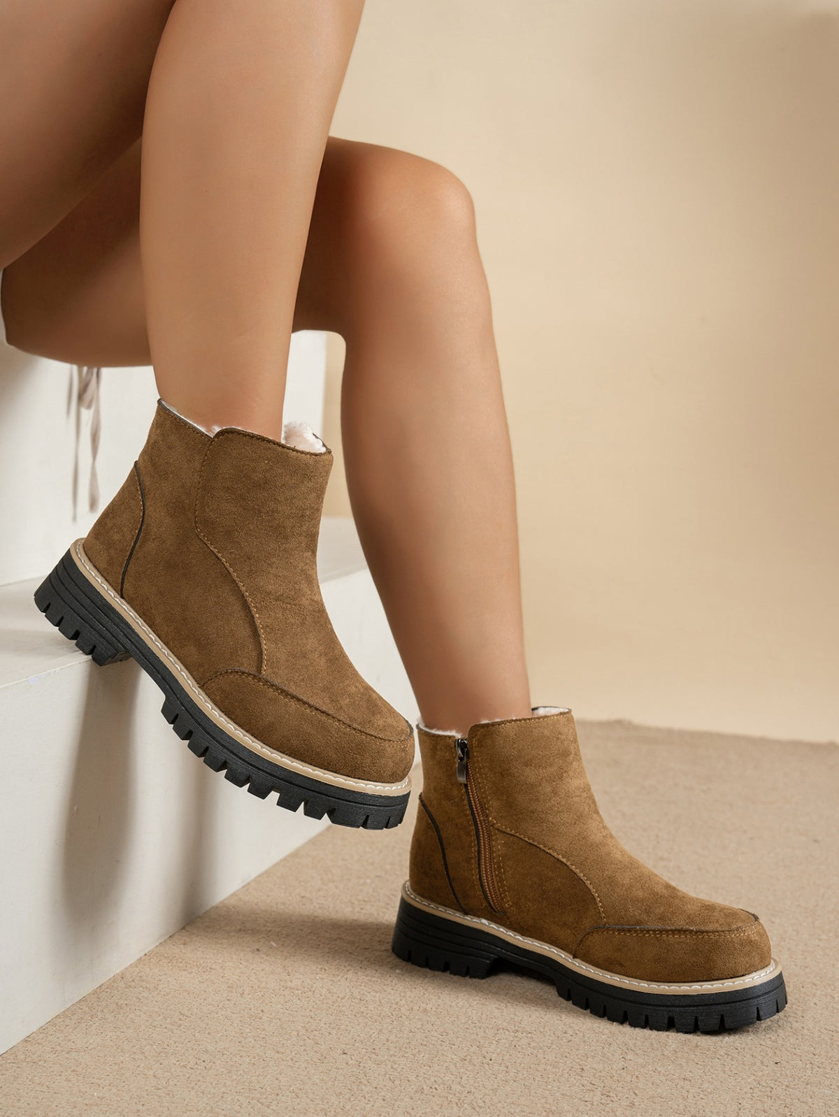 Margo & Main brown plush-lined side-zip ankle boots — worn side view of the zip and lug sole, US women's sizes