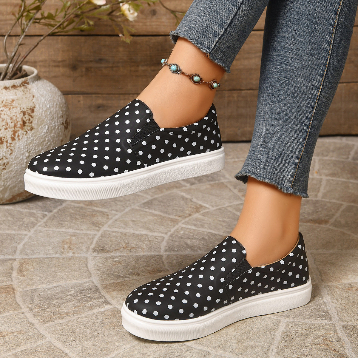 Margo & Main black polka dot platform slip-on loafers — side view of the elastic gores and sole