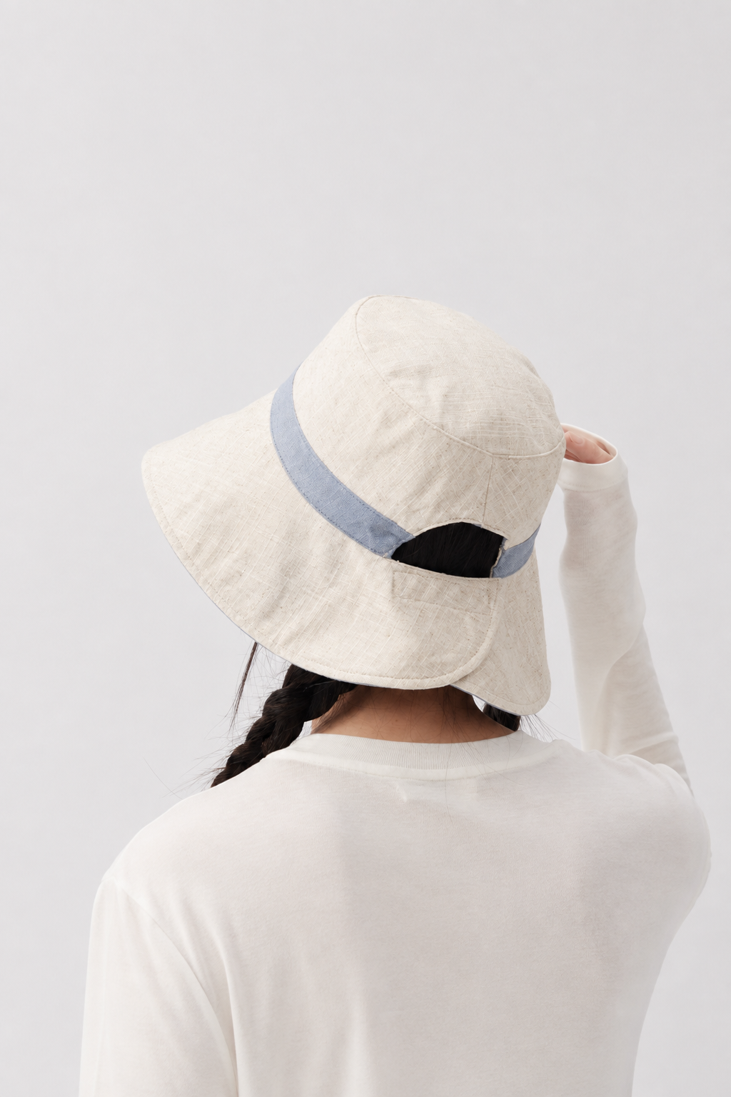 Margo & Main – Sabella light blue reversible bucket sun hat from the back, showing the split brim and adjustable back tab