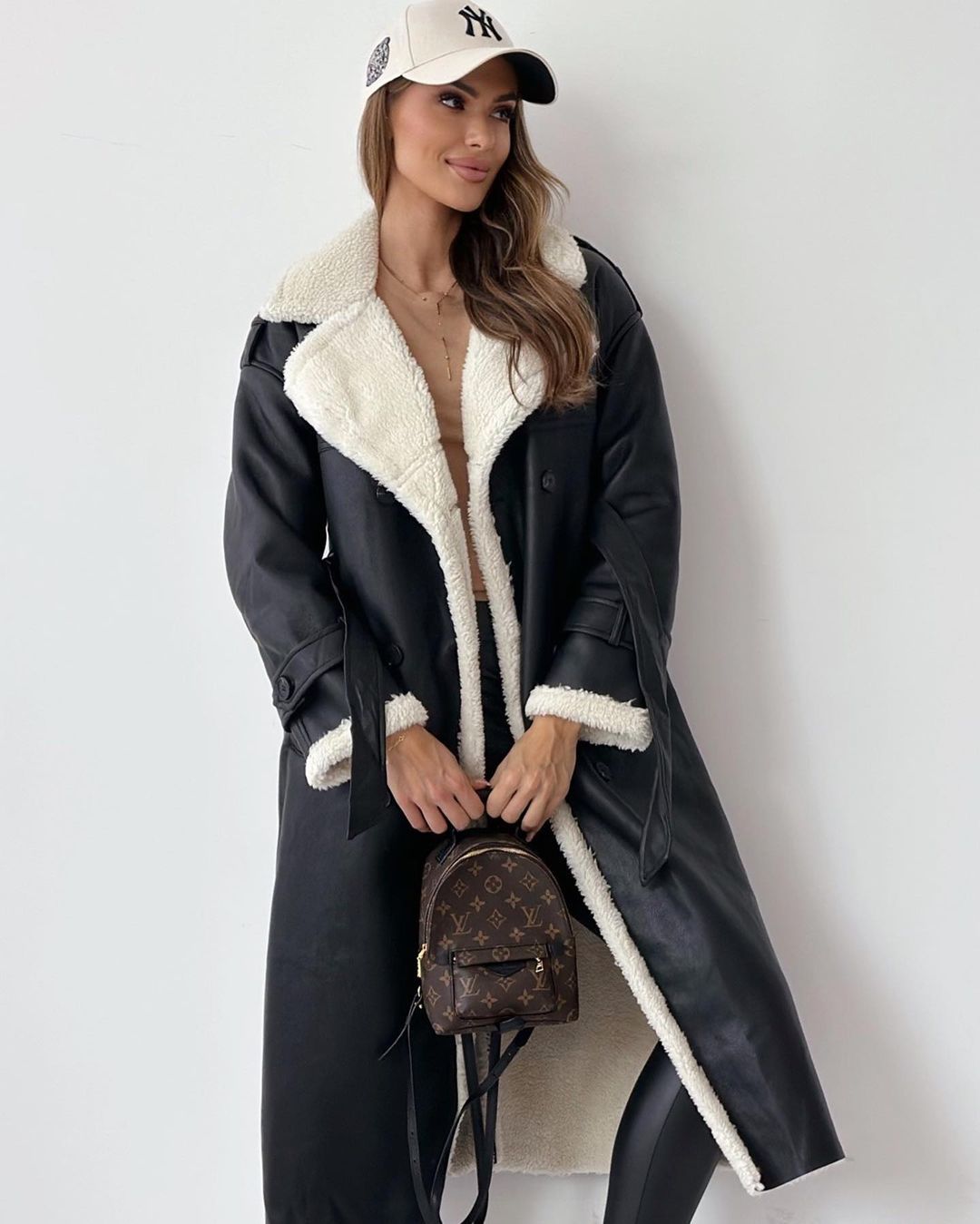 Margo & Main black faux shearling coat — front view of the belt and cream trim, US women's sizes