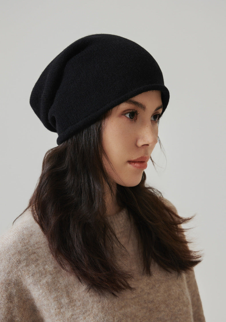 Margo & Main black wool beanie — front view of the slouchy crown and the rolled-up knit brim
