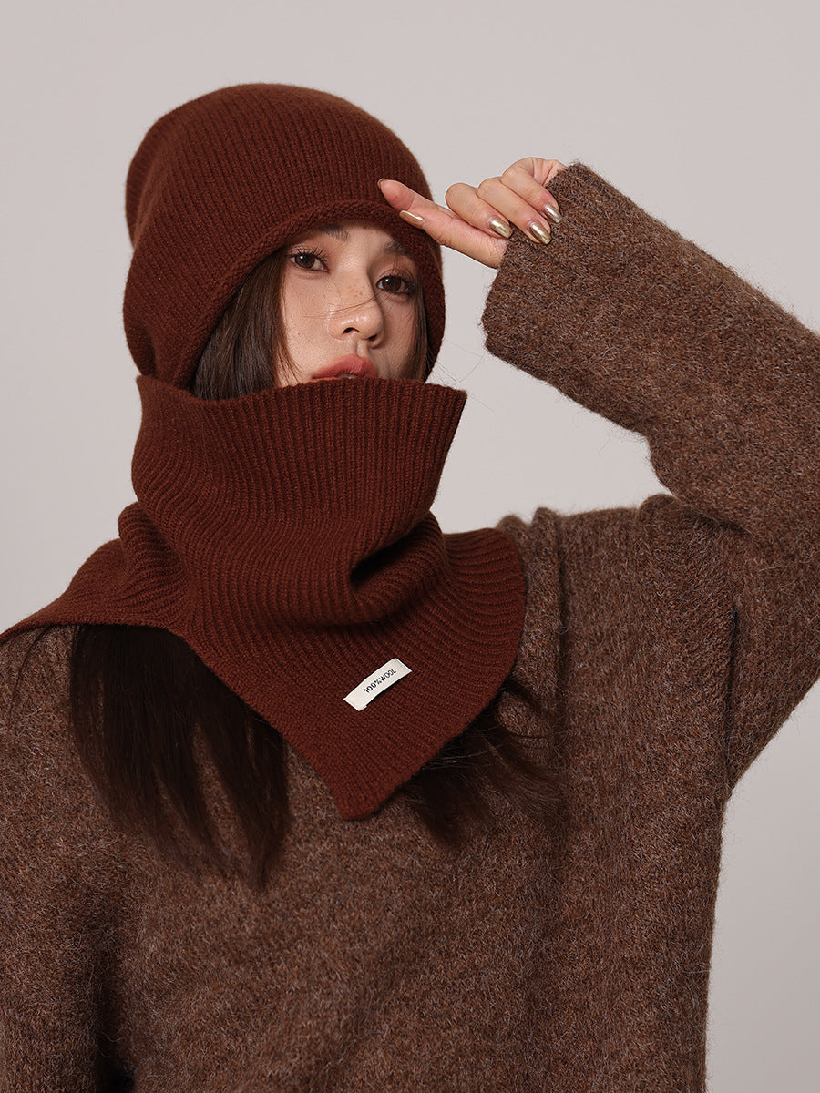 Margo & Main chocolate wool beanie and snood set — angled view with the beanie being adjusted