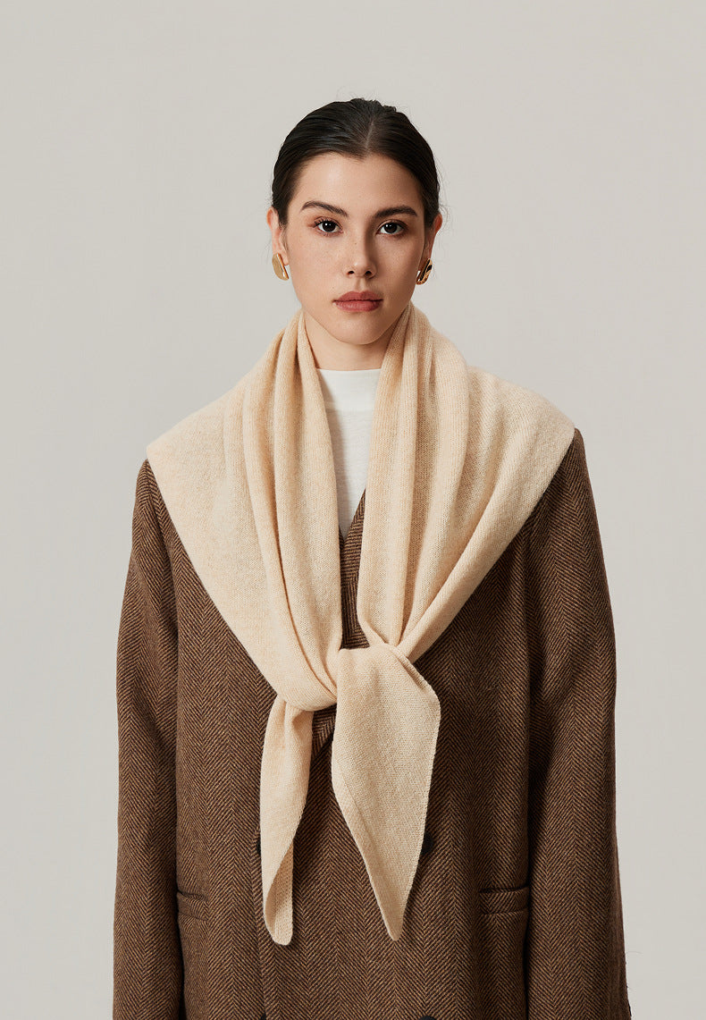 Margo & Main beige lamb wool triangle scarf — front view knotted over a brown wool coat