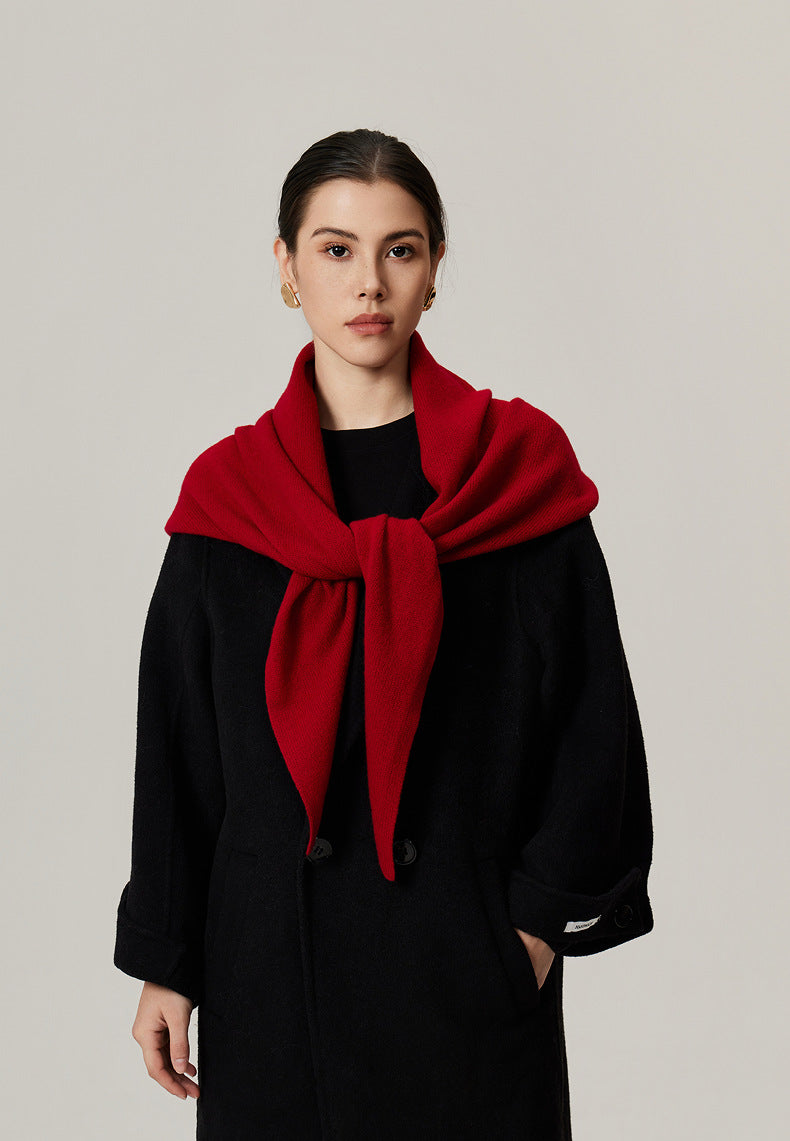 Margo & Main red lamb wool triangle scarf — front view knotted at the chest over a black coat